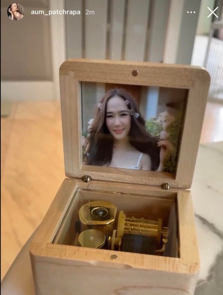 Image of a music box with a picture inside